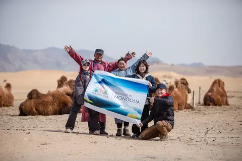 Travelers with camels in the Gobi desert