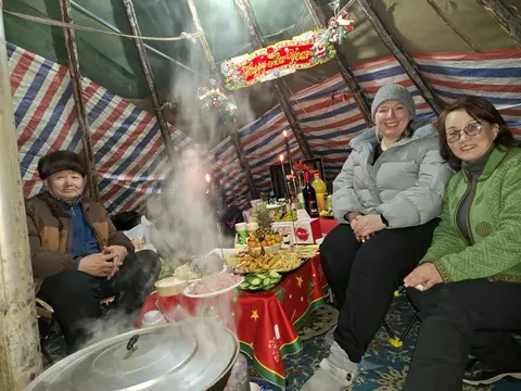 Sharing a meal inside a ger