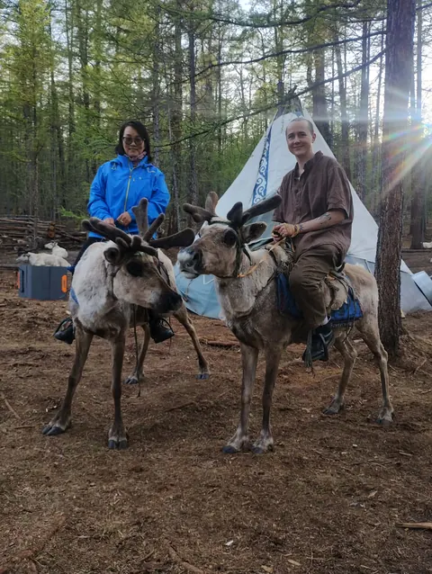 Riding reindeer in the taiga