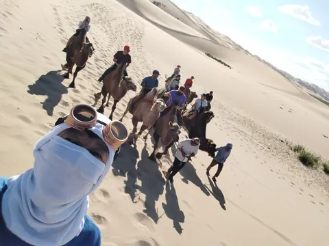 Camel ride across the sand dunes