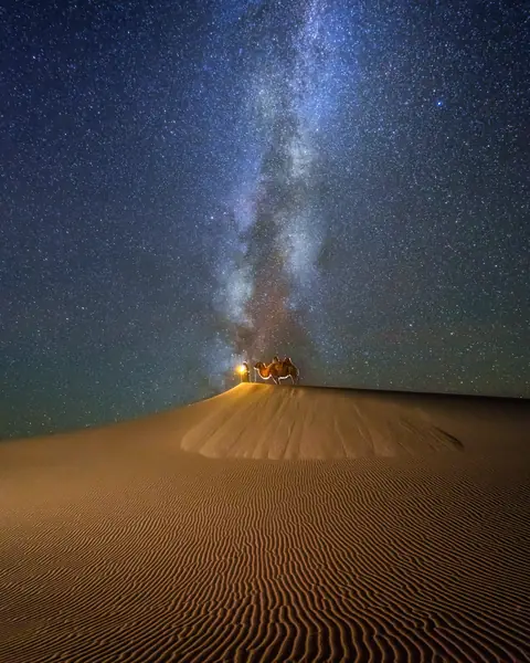 Milky Way over a sand dune at night