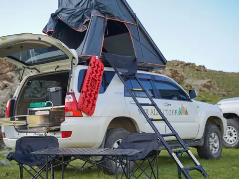 Toyota Hilux Surf 215 with rooftop tent and slide-out kitchen